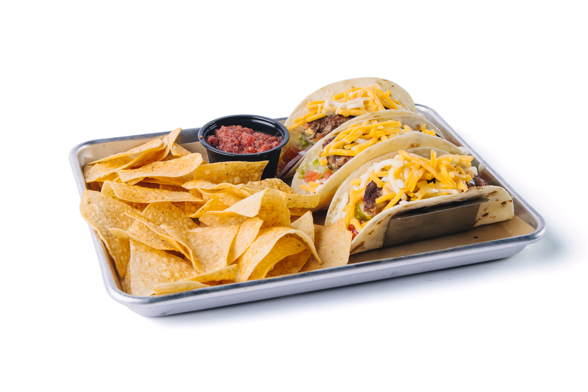 image of our cheeseburger tacos with tortilla chips and a side of salsa