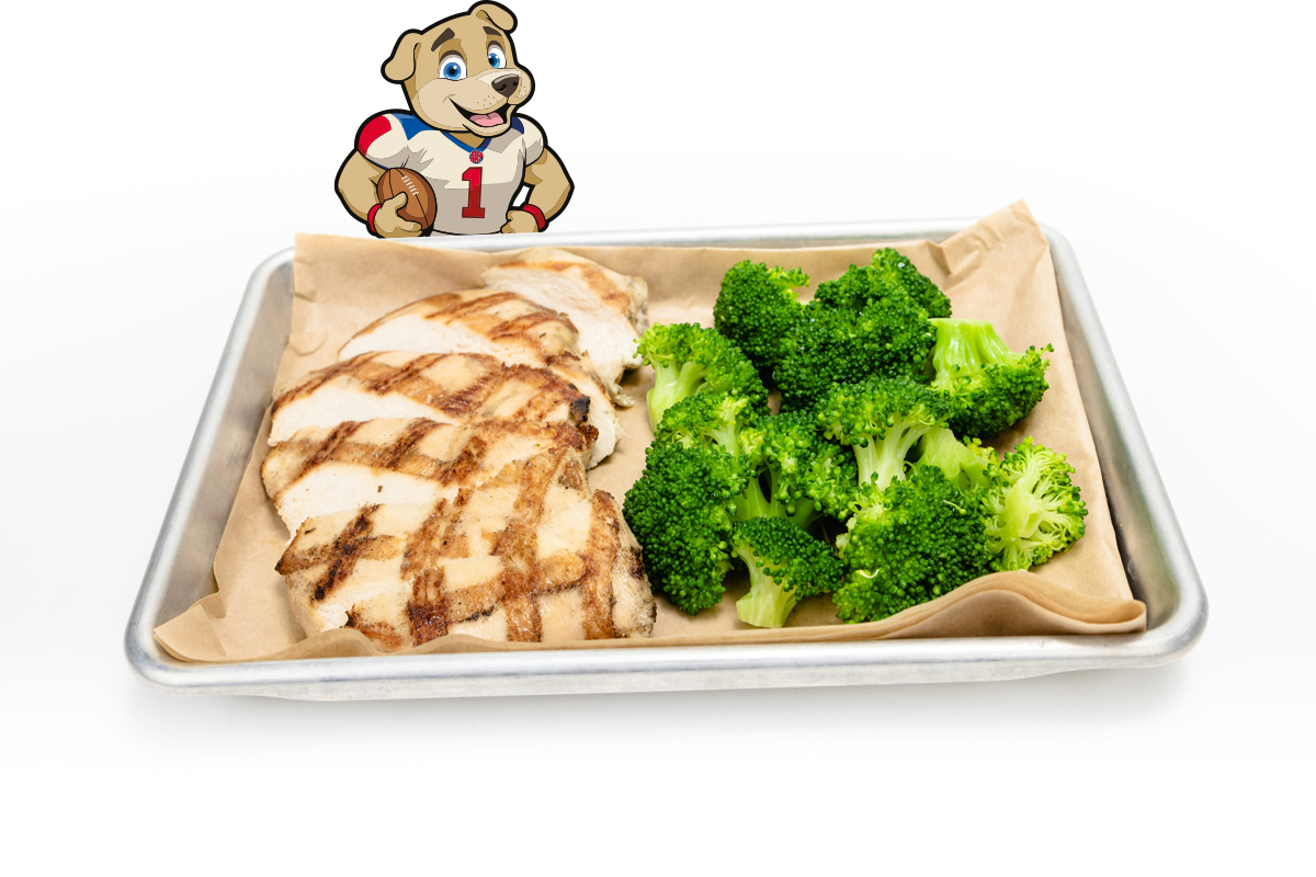 image of sliced, grilled chicken on a sheet tray with broccoli florets.