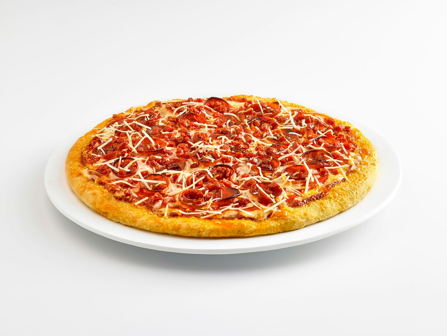 Image of ultimate pepperoni pizza on a plate.