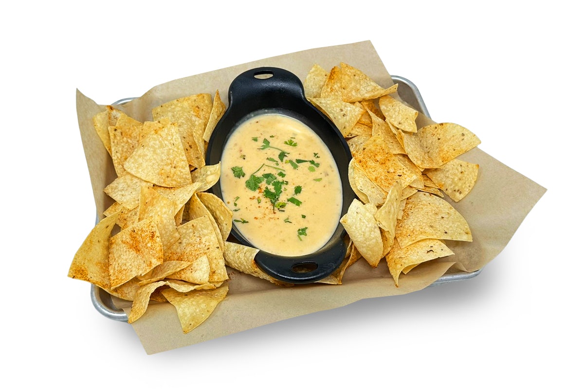Photo of chips and queso on a sheet pan
