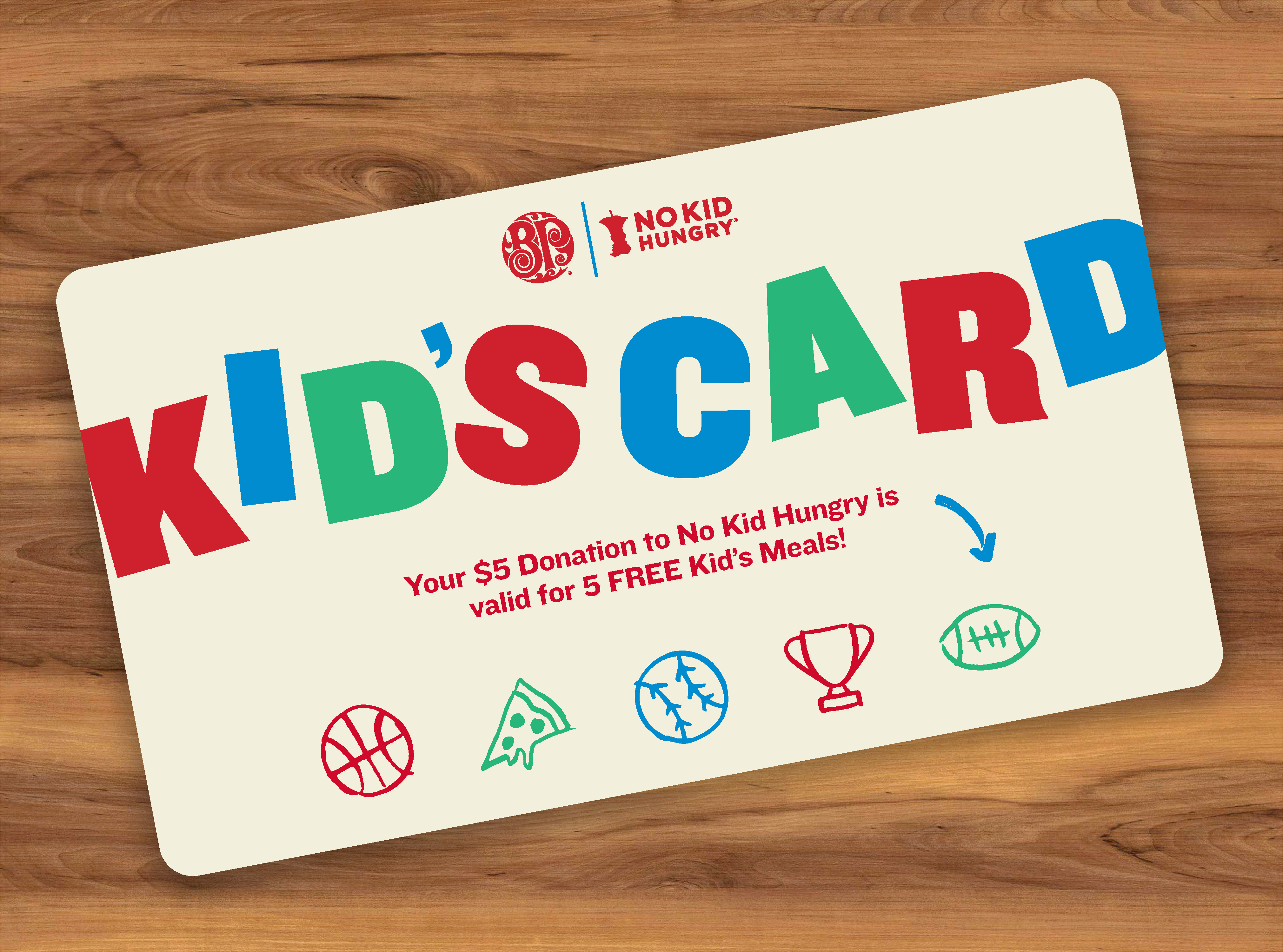 Image of kid's card on wooden surface.