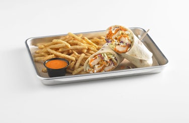 Image of buffalo chicken wrap served with fries.