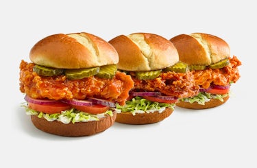 image of three fried chicken sandwiches each with a different sauce.