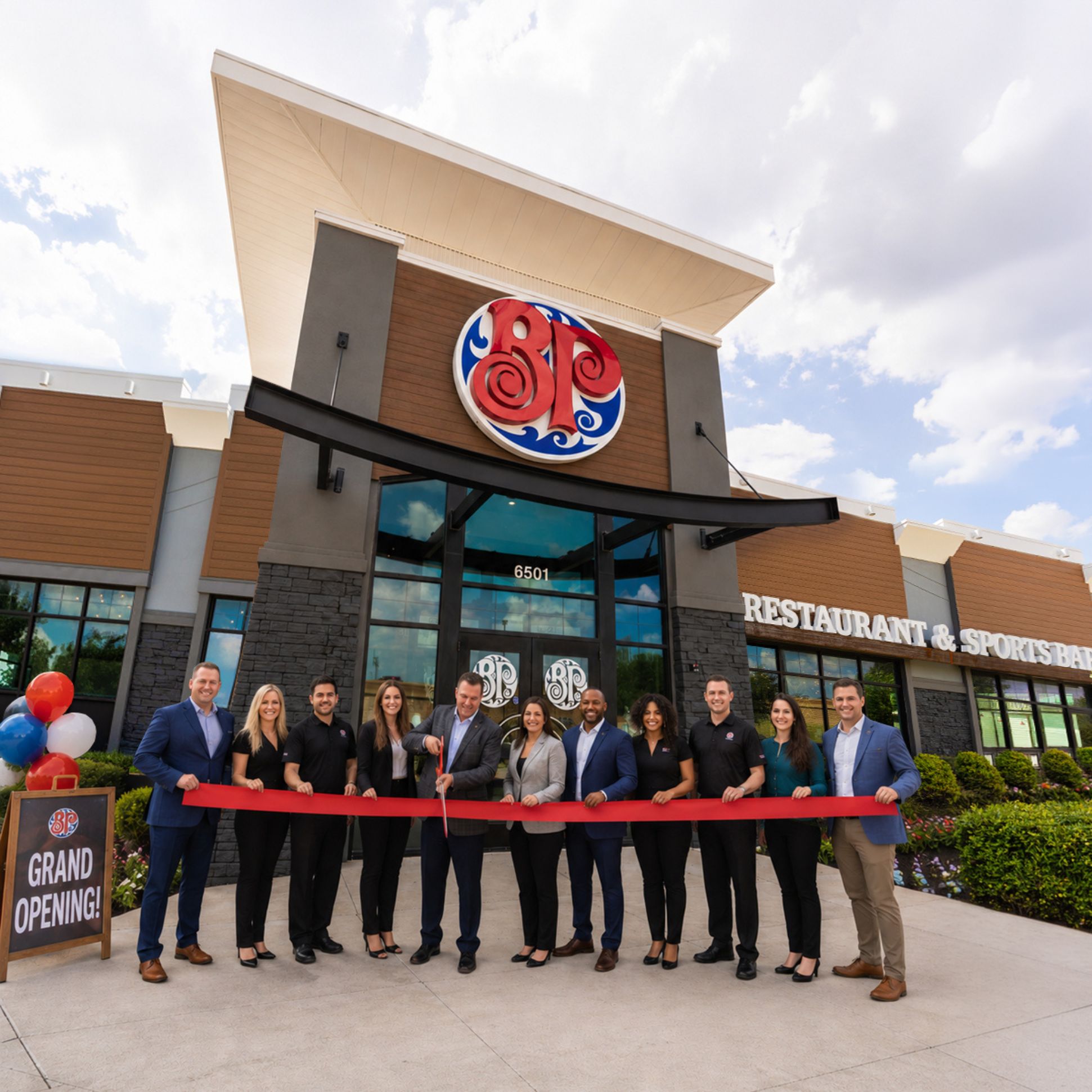 image of franchisees cutting a red ribbon when opening a restaurant